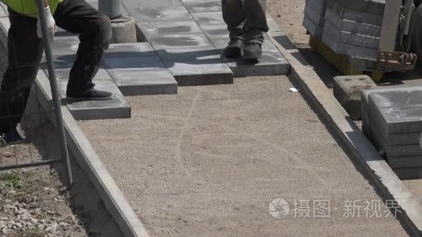 construction worker make sidewalk with cement tile. 4K