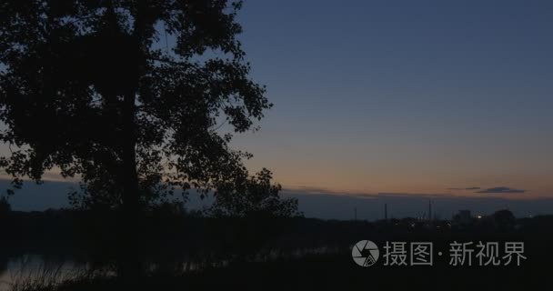 Trees Silhouette,Blue Sky With Lilac Clouds, Sity on a Horizon