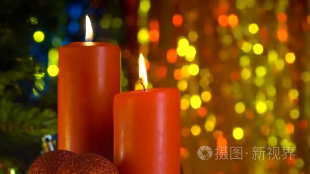 圣诞节场景的燃烧的红色蜡烛视频