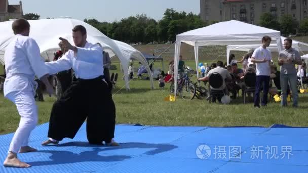 master of martial art teach follower man in front of people audi