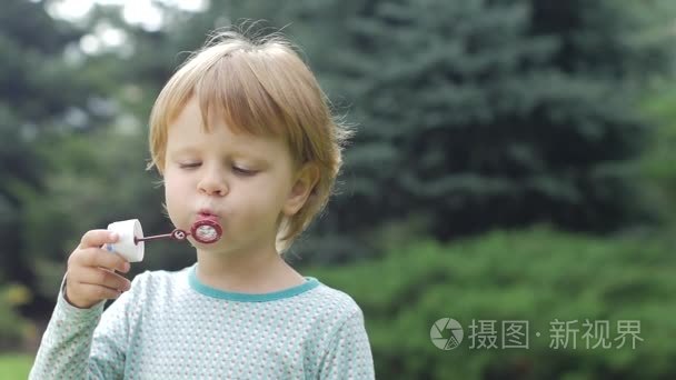 little girl with soap bubbles. Slow motion. Close up