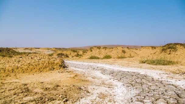 Desert Road With Hardened Volcano Mud At The Valley