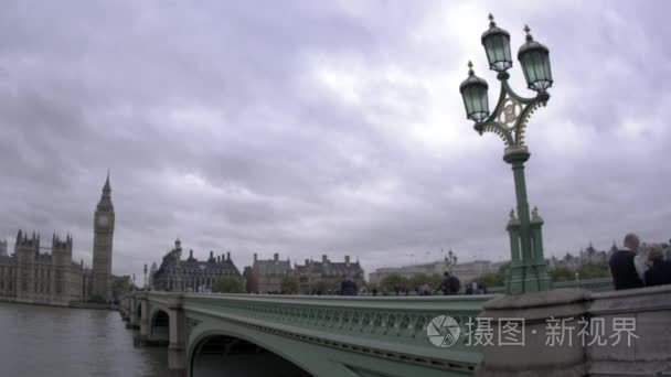 people cross Westminster Bridge in London