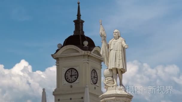 Monument to explorer Christopher Columbus and tower with watch o