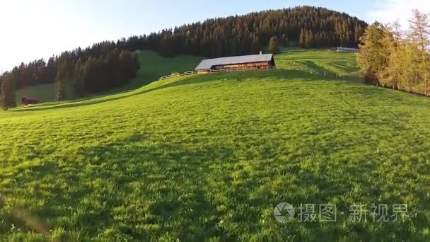 Wooden house on green hill forest in background, Leysin