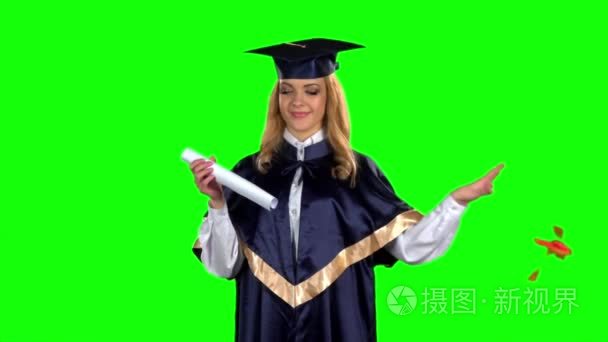 Graduate opens his diploma. Green screen. Slow motion