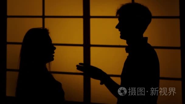 Couple fighting at home. Relations with quarrels. Silhouette. Cl