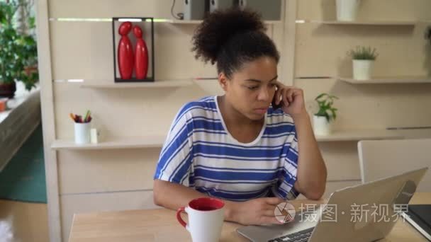 Young professional mixed race businesswoman working in the moder