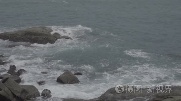 Powerful sea waves crashing on the rocks