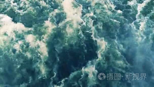 Huge waves stream of deep blue water with foam rising