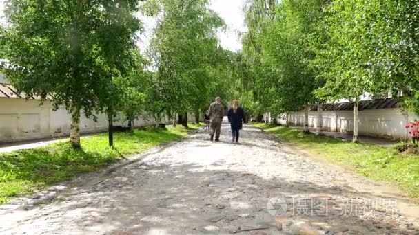 walk people through the alley historic Old Russian Cyril-Belozer