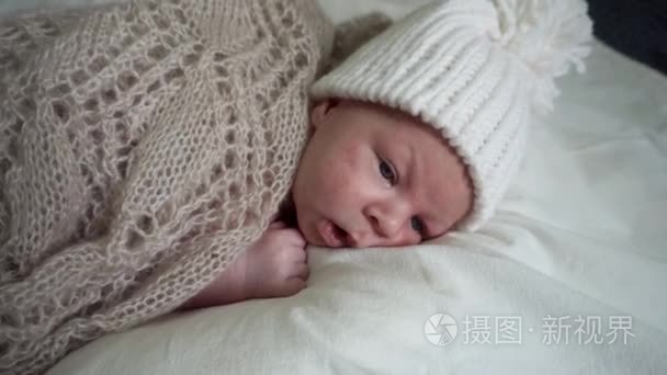 Infant Newborn Baby Child Lay in Knitted Clothes on Blanket