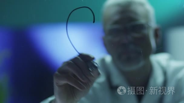 Scientist is Drawing Heart with Marker on Glass. Shot on RED Cin