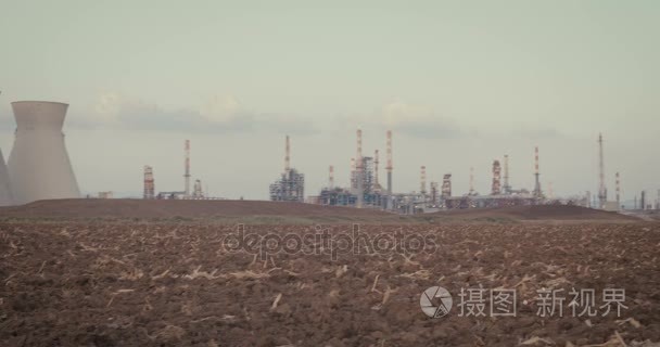 Save our planet. Young kids standing near a refinery with gas ma