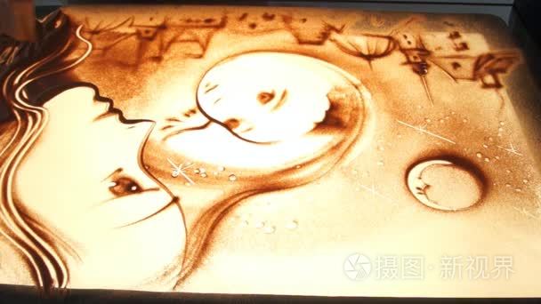 用沙子画画.在白色的屏幕上绘制沙子.沙子艺术家.手画短视频