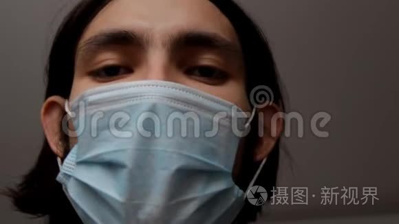 戴着外科口罩遮住下半边脸的男人。医疗和保健概念