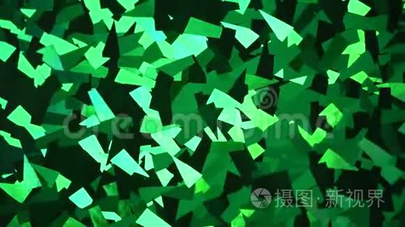 抽象晶体背景。 绿色闪光纹理的微光。 有光泽的背景旋转