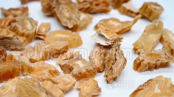 侧视药材白布或玄参或日本茎根旋转暂停短视频