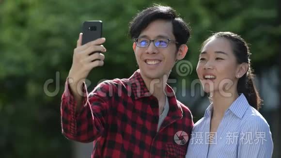年轻的亚裔夫妇一起在户外活动视频