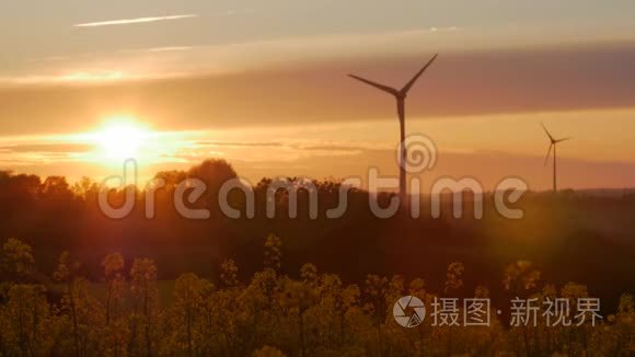 日落时有光线的风力涡轮机农场