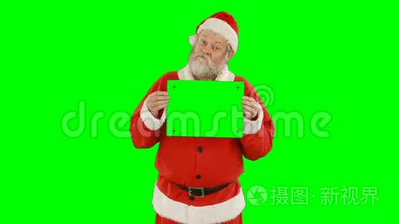 圣诞老人手持空白标语的画像