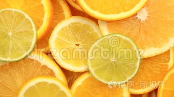 新鲜的柑橘类水果。 旋转视频镜头的概念，健康饮食和饮食。 旋转切片橙子，石灰，柠檬，葡萄